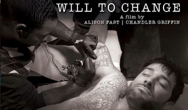 Tattoo session in progress, black and white