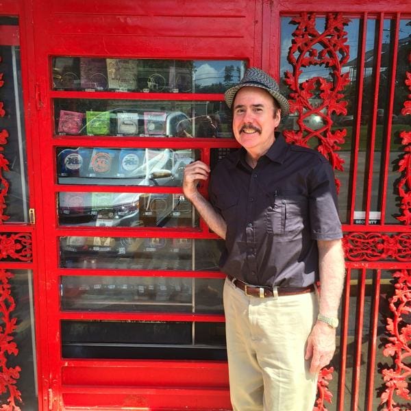 Owner Joe Nathan in front of his 24 hour vending machine at Consignment Music Store on Park in Memphis.