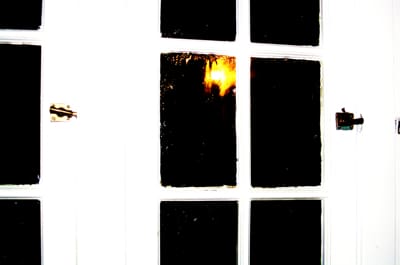 Dark window with bright light reflection
