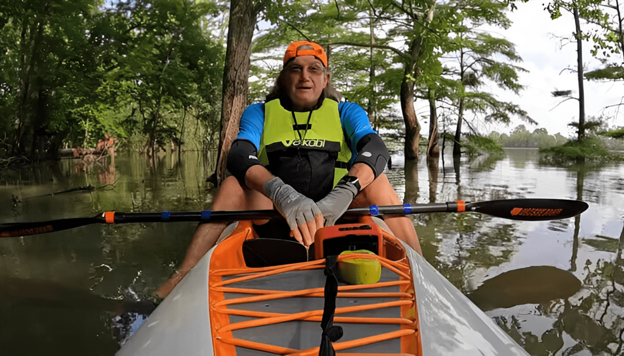 Kayaker paddling through calm waters