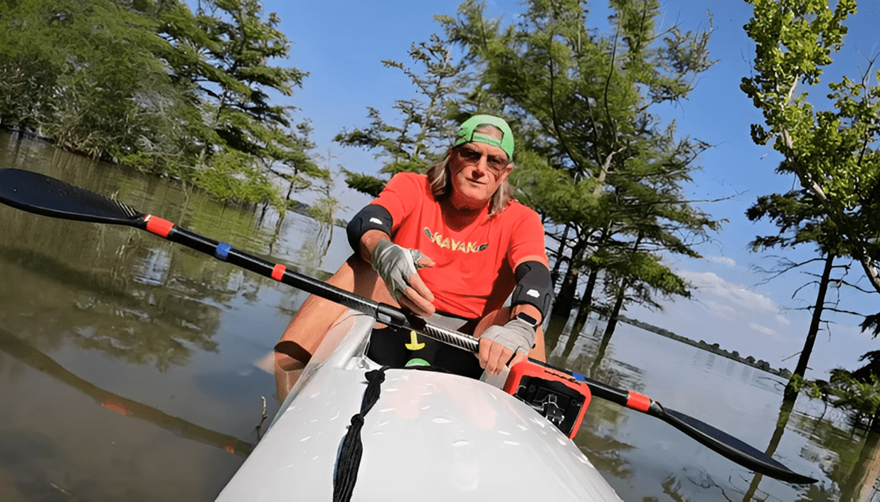 Kayaker navigating among trees