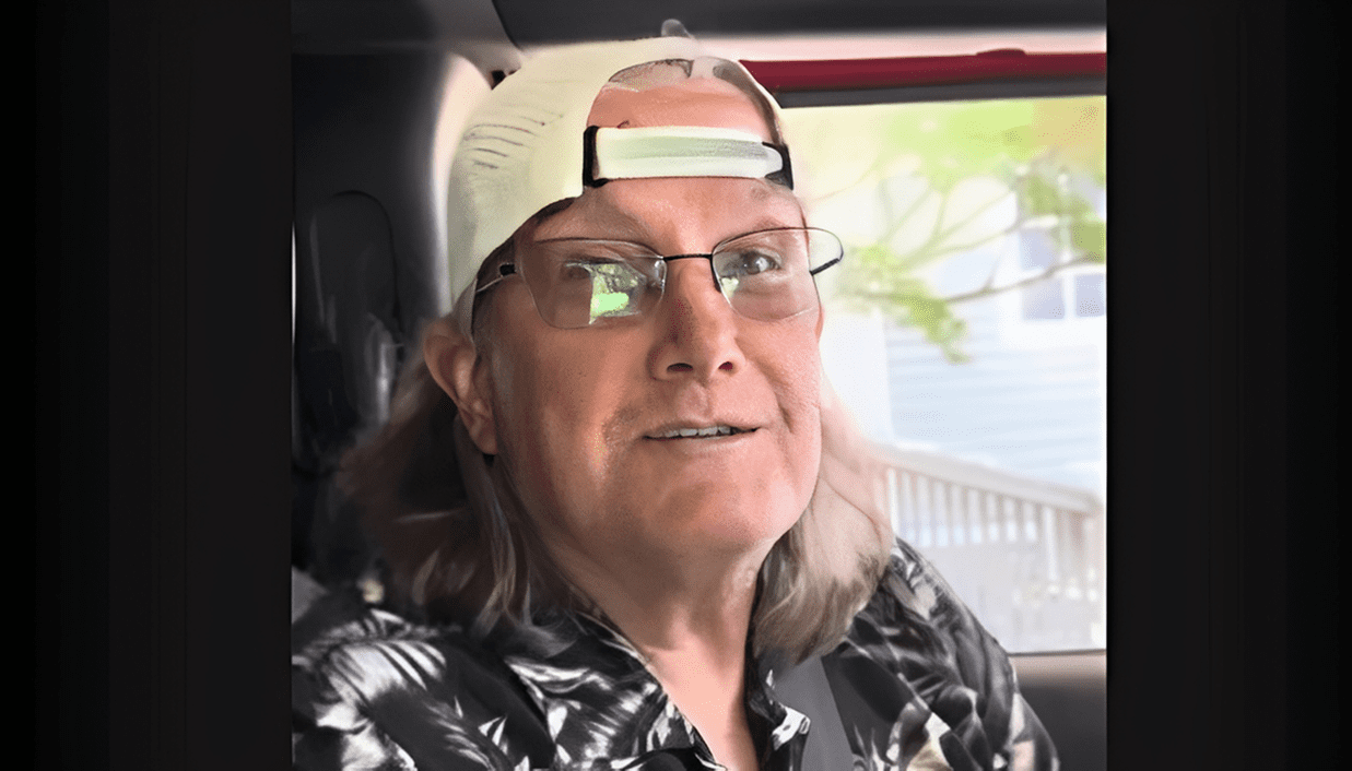 Person with long hair, floral shirt