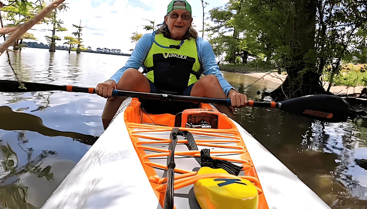 Person kayaking with safety gear