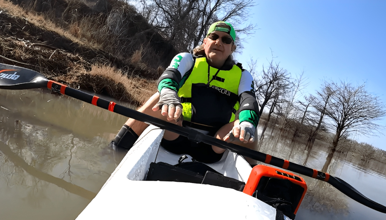 Person kayaking on a calm river