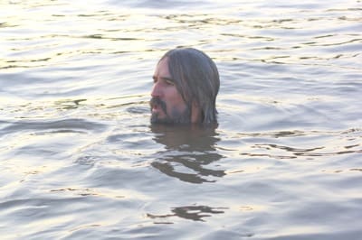 Person submerged in lake