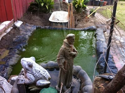 Outdoor water feature with statue