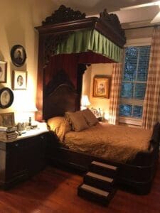 A Southern lady's bedroom and her devoted Siamese feline named Bamboo.