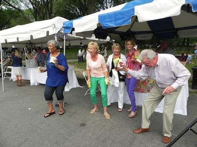 Group enjoying dance under tents