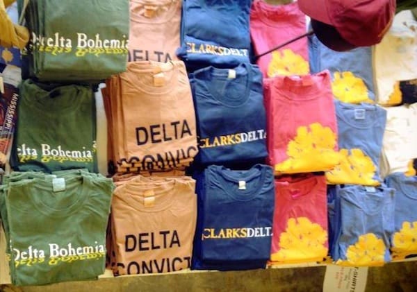 Colorful t-shirts arranged on a table