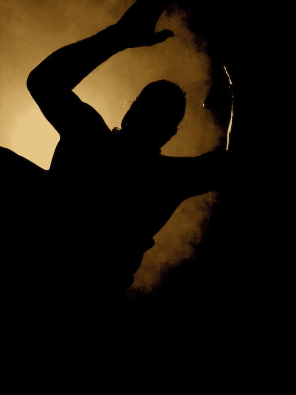 Person in dramatic silhouette pose