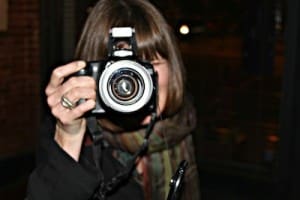 Person taking photo with DSLR camera